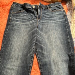 American Eagle Next Level Stretch Jeggings - blue with some washed out areas.